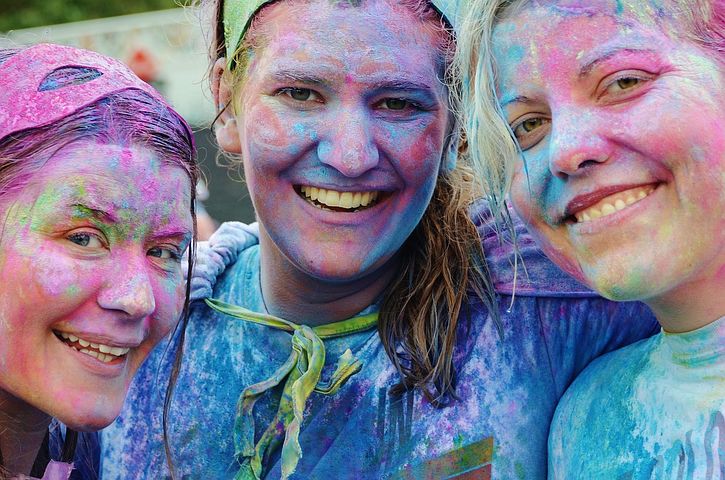 Three girls at chairty paint running festival