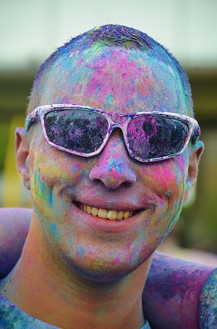 Man at a chairty paint running festival